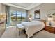 Bright and airy main bedroom with large window, plush carpeting, and sitting area at 4020 Cascina Way, Sarasota, FL 34238