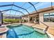 Resort-style screened pool with a view of the backyard at 4020 Cascina Way, Sarasota, FL 34238