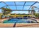 Inviting screened pool with brick patio and tranquil water feature at 4020 Cascina Way, Sarasota, FL 34238