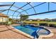 Luxury screened pool with a tranquil water feature at 4020 Cascina Way, Sarasota, FL 34238