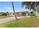 Gray house with a brick facade and driveway at 4026 Indianapolis Ne St, St Petersburg, FL 33703