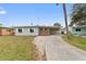 Ranch-style home with a carport and spacious yard at 4026 Indianapolis Ne St, St Petersburg, FL 33703