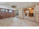 Large living room with brick wall and sliding glass doors at 4026 Indianapolis Ne St, St Petersburg, FL 33703