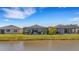 View of backyard oasis with screened lanai and pool at 4110 Mossy Limb Ct, Palmetto, FL 34221