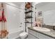 Bathroom with a tub, granite vanity, and shelving at 4110 Mossy Limb Ct, Palmetto, FL 34221