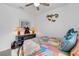 Bedroom with multicolored patchwork comforter at 4110 Mossy Limb Ct, Palmetto, FL 34221