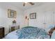 Bedroom with a patterned comforter and built-in closet at 4110 Mossy Limb Ct, Palmetto, FL 34221