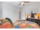 Bedroom with multicolored patchwork comforter at 4110 Mossy Limb Ct, Palmetto, FL 34221