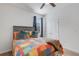 Bedroom with multicolored patchwork comforter at 4110 Mossy Limb Ct, Palmetto, FL 34221