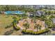 Aerial view of community pool, playground, and clubhouse at 4110 Mossy Limb Ct, Palmetto, FL 34221