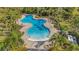 Relaxing community pool with ample lounge space at 4110 Mossy Limb Ct, Palmetto, FL 34221