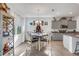 Bright dining area adjacent to the kitchen with a table and four chairs at 4110 Mossy Limb Ct, Palmetto, FL 34221