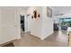 Bright hallway with tile flooring and access to other rooms at 4110 Mossy Limb Ct, Palmetto, FL 34221