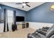 Home theater room with large TV and comfortable seating at 4110 Mossy Limb Ct, Palmetto, FL 34221