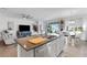 Open concept kitchen with a view of the living area and access to the backyard at 4110 Mossy Limb Ct, Palmetto, FL 34221