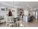 Modern kitchen with gray cabinets, granite countertops, and stainless steel appliances at 4110 Mossy Limb Ct, Palmetto, FL 34221