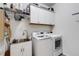 Laundry room with washer, dryer, and utility sink at 4110 Mossy Limb Ct, Palmetto, FL 34221