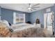 Main bedroom with water view and comfortable bed at 4110 Mossy Limb Ct, Palmetto, FL 34221