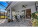 Enjoyable screened patio with seating and access to the home at 4110 Mossy Limb Ct, Palmetto, FL 34221