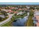 Aerial view of McIntosh Lake community, showcasing homes and waterways at 4452 Mcintosh Lake Ave, Sarasota, FL 34233