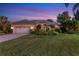 Single-story home with a white garage door and landscaped front yard at 4452 Mcintosh Lake Ave, Sarasota, FL 34233