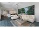 Spacious living room with comfy couches and large landscape art at 4452 Mcintosh Lake Ave, Sarasota, FL 34233