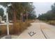 Paved walking trail in a community setting at 4452 Mcintosh Lake Ave, Sarasota, FL 34233