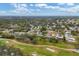 Aerial view of neighborhood with golf course in view at 5006 W Country Club Dr, Sarasota, FL 34243