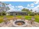 Firepit and seating area in the backyard at 5006 W Country Club Dr, Sarasota, FL 34243