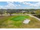 Aerial view of green with sand trap at 5006 W Country Club Dr, Sarasota, FL 34243