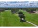 Aerial view of a scenic golf course with a winding path at 5006 W Country Club Dr, Sarasota, FL 34243