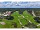 Aerial view showcasing a vast expanse of a golf course at 5006 W Country Club Dr, Sarasota, FL 34243