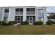 Condo building with screened porch and lawn at 5310 26Th W St # 501, Bradenton, FL 34207