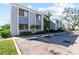 Light blue condo building with parking and landscaping at 5310 26Th W St # 501, Bradenton, FL 34207