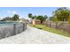 Backyard with pool, patio, and shed. Plenty of green space at 542 Baywood S Dr, Dunedin, FL 34698