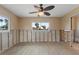 Unfinished bedroom with new flooring and ceiling fan at 542 Baywood S Dr, Dunedin, FL 34698