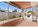 Screened porch overlooking the backyard and patio at 542 Baywood S Dr, Dunedin, FL 34698