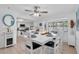 Open concept dining room with whitewashed table and chairs, near kitchen at 5420 4Th Avenue Nw Dr, Bradenton, FL 34209