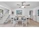 Bright dining room with whitewashed table and chairs, near kitchen at 5420 4Th Avenue Nw Dr, Bradenton, FL 34209