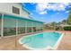 Refreshing kidney-shaped pool with concrete decking at 5420 4Th Avenue Nw Dr, Bradenton, FL 34209