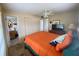 Bedroom with a queen bed, TV, and ensuite bathroom at 5885 17Th W St # B21, Bradenton, FL 34207