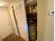 Hall closet with water heater and shelving at 5885 17Th W St # B21, Bradenton, FL 34207