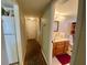 Hallway with a view of the bathroom and linen closet at 5885 17Th W St # B21, Bradenton, FL 34207