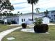 Community building with landscaping and a fountain at 5911 Canal Dr # I-31, Bradenton, FL 34207