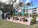 Outdoor picnic area with tables and umbrellas, perfect for gatherings at 5911 Canal Dr # I-31, Bradenton, FL 34207