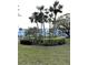 Lush landscaping featuring palm trees and manicured hedges at 5911 Canal Dr # I-31, Bradenton, FL 34207