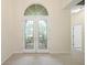 Bright entryway with double doors and hardwood floors at 6234 Sturbridge Ct, Sarasota, FL 34238