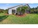 House exterior showcasing a screened patio and lush landscaping at 6234 Sturbridge Ct, Sarasota, FL 34238