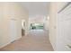 Hallway view of living area with sliding doors to lanai at 6234 Sturbridge Ct, Sarasota, FL 34238