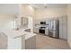 Updated kitchen with stainless steel appliances and gray cabinets at 6234 Sturbridge Ct, Sarasota, FL 34238